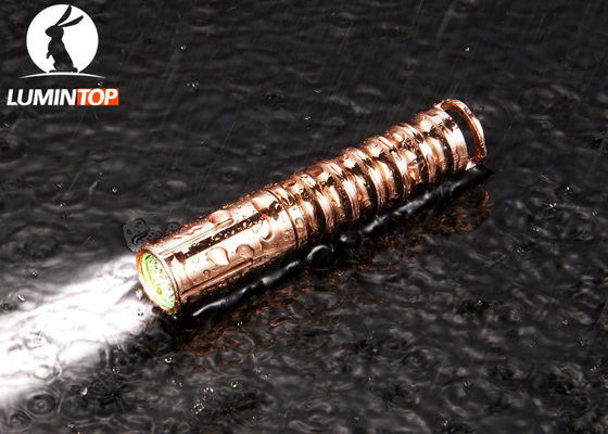 China Copper Cree LED Flashlight AAA Battery Powered EDC Mini Keychain Size supplier